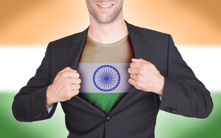 Businessman opening suit to reveal shirt with flag, india